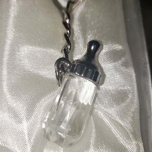 Darling glass baby bottle key ring.